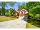 Charming two-story Tudor-style home with a two-car garage, set in a lush, green environment at 2261 Byron Sw Ct, Marietta, GA 30064