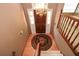 Grand foyer with hardwood floors, staircase, elegant chandelier, and views of a brightly lit home interior at 2261 Byron Sw Ct, Marietta, GA 30064