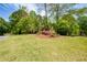 Charming home nestled among mature trees and lush landscaping on a well manicured lot at 2261 Byron Sw Ct, Marietta, GA 30064