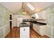 Bright kitchen features an island with granite countertop, appliances, skylight, and a ceiling fan at 2261 Byron Sw Ct, Marietta, GA 30064