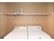 Bright laundry room featuring a washer and dryer with shelving for storage at 2261 Byron Sw Ct, Marietta, GA 30064