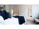 Bright bedroom featuring plush carpeting, white walls, walk-in closet, and ensuite bathroom at 4956 Villager Ln, Stone Mountain, GA 30083