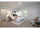 Bright bedroom with neutral tones, comfortable bed, and ample natural light at 4956 Villager Ln, Stone Mountain, GA 30083