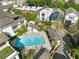 Community pool surrounded by houses, greenery, and lounge chairs in a residential area at 558 Bismark Ne Rd, Atlanta, GA 30324