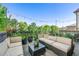 Comfortable outdoor living space with plush seating, string lights, and lush greenery at 558 Bismark Ne Rd, Atlanta, GA 30324
