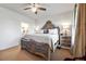 Ornate main bedroom featuring a decorative bed frame, ample natural light, and carpet flooring at 558 Bismark Ne Rd, Atlanta, GA 30324