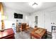 Well-lit room with a large TV, study desk, and view to the bathroom at 558 Bismark Ne Rd, Atlanta, GA 30324