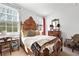 Comfortable bedroom featuring a decorative wooden bed frame and ample natural light at 558 Bismark Ne Rd, Atlanta, GA 30324