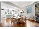 Charming dining room open to kitchen with hardwood floors, stylish chandelier, and ample natural light at 558 Bismark Ne Rd, Atlanta, GA 30324
