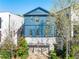 Blue two-story home with a garage and well-manicured lawn at 558 Bismark Ne Rd, Atlanta, GA 30324