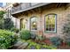 Charming brick home featuring a lush front garden and arched windows at 558 Bismark Ne Rd, Atlanta, GA 30324