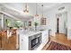 Open-concept kitchen with an island, hardwood floors, and access to the dining area at 558 Bismark Ne Rd, Atlanta, GA 30324