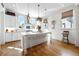 Well-lit kitchen with hardwood floors, a large island, and modern appliances at 558 Bismark Ne Rd, Atlanta, GA 30324