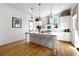 Bright, modern kitchen with a large island, white cabinets, and stainless steel appliances at 558 Bismark Ne Rd, Atlanta, GA 30324