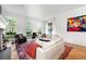 Elegant living room with large windows, hardwood floors, fireplace and views of the outdoor greenery at 558 Bismark Ne Rd, Atlanta, GA 30324