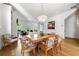 Spacious living room featuring hardwood floors, large windows, and an open floor plan to the dining area at 558 Bismark Ne Rd, Atlanta, GA 30324