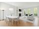Bright, airy living room with modern furniture, fireplace, built-in shelving, and large windows at 558 Bismark Ne Rd, Atlanta, GA 30324