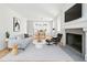Cozy living room showcasing hardwood floors, fireplace, modern furniture, and ample natural light at 558 Bismark Ne Rd, Atlanta, GA 30324