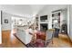 Bright and airy living room featuring a fireplace, built-in bookshelves, and hardwood floors at 558 Bismark Ne Rd, Atlanta, GA 30324