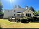 Backyard featuring a deck, grass lawn and mature trees at 180 Shyrewood Dr, Lawrenceville, GA 30043