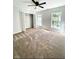 Spacious bedroom with neutral carpet, two windows and a closet at 180 Shyrewood Dr, Lawrenceville, GA 30043