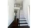 Foyer with dark wood floors and staircase leading to the upper level at 180 Shyrewood Dr, Lawrenceville, GA 30043