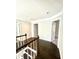 Hallway featuring hardwood floors and neutral paint at 180 Shyrewood Dr, Lawrenceville, GA 30043
