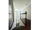 Hallway with hardwood steps, white risers, and neutral walls at 180 Shyrewood Dr, Lawrenceville, GA 30043