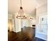 Bright living room boasts hardwood floors, and a decorative chandelier at 180 Shyrewood Dr, Lawrenceville, GA 30043