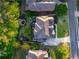 An aerial view of a home showcasing the roof, backyard with pond, patio, trees and well maintained lawn at 2270 Abbey Cove Ct, Marietta, GA 30062