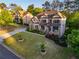 Aerial view of a large home with a manicured lawn and mature trees at 2270 Abbey Cove Ct, Marietta, GA 30062