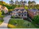 Aerial view of a two-story home with a manicured lawn and lush greenery at 2270 Abbey Cove Ct, Marietta, GA 30062