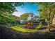 Spacious backyard with lush lawn, mature trees, and a charming playset at 2270 Abbey Cove Ct, Marietta, GA 30062