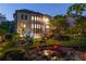 Beautifully landscaped backyard with lush garden, pond, and patio seating at 2270 Abbey Cove Ct, Marietta, GA 30062