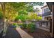 Landscaped backyard featuring a wooden deck, grill area, and lush greenery at 2270 Abbey Cove Ct, Marietta, GA 30062