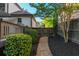 Backyard with privacy fence, landscaping, and stone pathway to a basketball court at 2270 Abbey Cove Ct, Marietta, GA 30062