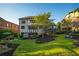 Expansive backyard featuring a lush lawn, mature trees, deck, spa, and stylish landscaping, creating a private outdoor oasis at 2270 Abbey Cove Ct, Marietta, GA 30062