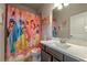 A bathroom with a Princess-themed shower curtain and vanity with a modern faucet at 2270 Abbey Cove Ct, Marietta, GA 30062