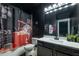 Unique bathroom with dark walls, granite countertop, and a movie themed shower curtain at 2270 Abbey Cove Ct, Marietta, GA 30062