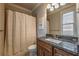 Bathroom with dark wood vanity and framed mirror at 2270 Abbey Cove Ct, Marietta, GA 30062