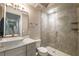 Modern bathroom with tile flooring, glass enclosed shower, and stylish sink and countertop at 2270 Abbey Cove Ct, Marietta, GA 30062