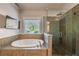 This bathroom features a soaking tub, large window, and glass-enclosed shower at 2270 Abbey Cove Ct, Marietta, GA 30062