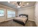 Comfortable bedroom with ceiling fan, closet and door to the backyard. Bathed in natural light at 2270 Abbey Cove Ct, Marietta, GA 30062