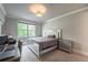 Bedroom with grey walls, carpet flooring, and a silver accent bed at 2270 Abbey Cove Ct, Marietta, GA 30062