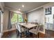 Well-lit dining area featuring a marble table, elegant chairs, and backyard view at 2270 Abbey Cove Ct, Marietta, GA 30062