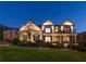Inviting two-story home featuring manicured landscaping and subtle exterior lighting at 2270 Abbey Cove Ct, Marietta, GA 30062