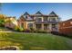 Stately two-story home with a brick and stone exterior and a well-maintained front lawn at 2270 Abbey Cove Ct, Marietta, GA 30062