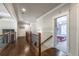 Bright hallway features hardwood floors, decorative railings, and views into well-lit rooms at 2270 Abbey Cove Ct, Marietta, GA 30062