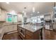 Spacious kitchen with granite island, stainless steel microwave, and hardwood floors at 2270 Abbey Cove Ct, Marietta, GA 30062