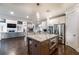 Kitchen island featuring granite countertop, stainless steel microwave, and barstool seating at 2270 Abbey Cove Ct, Marietta, GA 30062
